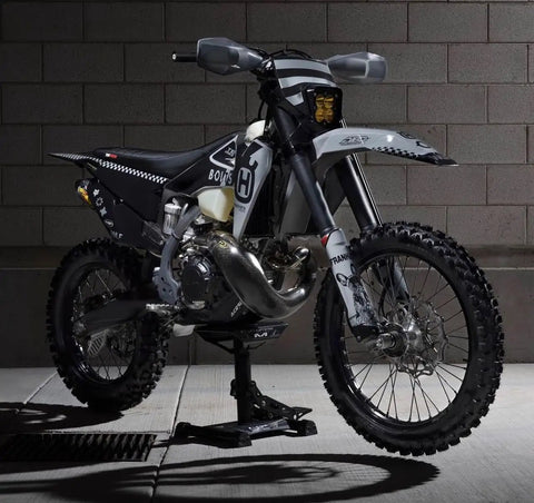 Side view of bike on Beefy Heavy Duty Lift Stand For Dirt Bikes And Mini Riders 500 Lb Capacity Carbon Steel Construction Lightweight Yet Durable