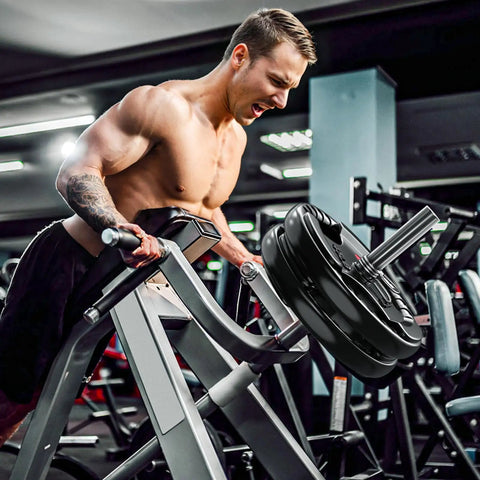 Man using Heavy Duty 2 Inch Olympic Rubber Weight Plates For Barbell Strength Training And Weightlifting during workout.