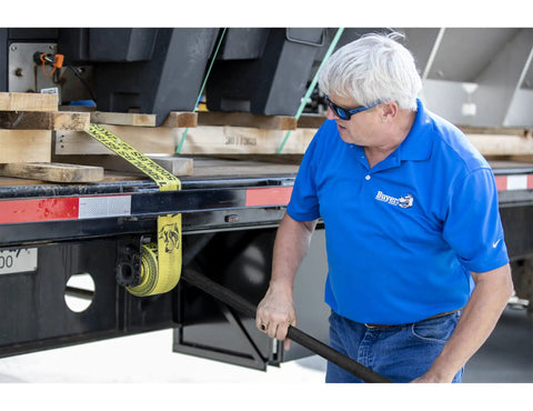 Person using 40 Inch Combo Winch Bar For Steel Trailer Winches, Black Powder Coated Carbon Steel, Heavy-Duty Leverage Tool on trailer