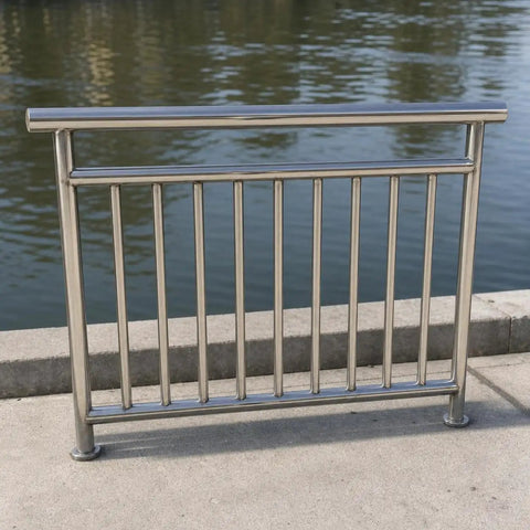 Heavy Duty Outdoor Railing Guardrail For Balcony And Deck Crafted From Top Shelf 304 Stainless Steel on a concrete walkway by water