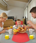 8 Pack 4 Oz Glass Creamer Pitchers Set Clear Milk Pourers With Easy Grip Handles on family dining table during meal