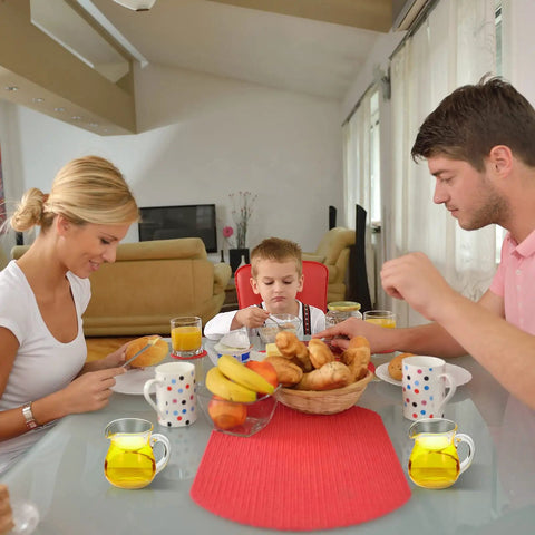 8 Pack 4 Oz Glass Creamer Pitchers Set Clear Milk Pourers With Easy Grip Handles on family dining table during meal