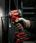 Top Shelf 21V Brushless Cordless Drill And Impact Driver Combo in use, gripping handle while driving a screw into metal.