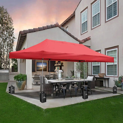 Red pop-up canopy with 4 Pack Canopy Water Weight Bags 25L Each, 220 Lbs Total, on a patio for stability