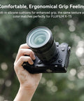 Hand holding X T5 L Shape Grip With Built In Arca Quick Release Plate For Fujifilm X T5 Camera Comfy Silicone Handgrip outdoors