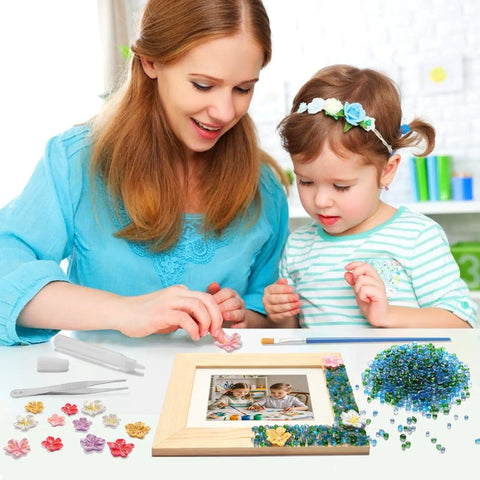 Mother and child using Mosaic Photo Frame Kit For Kids With Glass Pebbles, Hands On Arts And Crafts Activity on wooden frame.