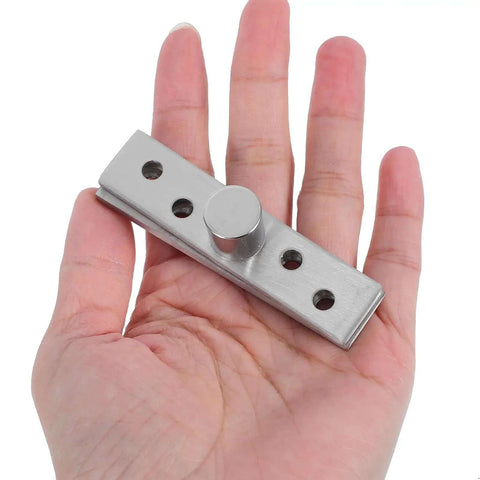 Person holding Hidden Rotation Pivot Hinges Set, 360 Degree Concealed Door Shaft, Stainless Steel, for secret doors and cabinets.