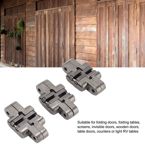 Mini Invisible Door Hinge Set 3 Pack For Cabinets Jewelry Boxes And Wooden Doors 43mm Zinc Alloy Cross Hinge 180 Degree Opening Built To Last Heavy Duty Hidden Hinges Black shown in front of wooden doors