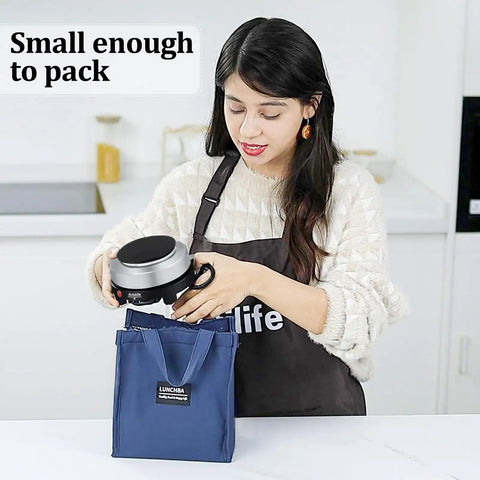 Woman packing 500W Mini Electric Hot Plate For Coffee Nerds Moka Pot Friendly 110V Compact RV Camping Stove into a blue bag