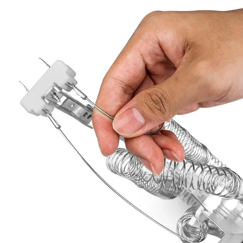 Hand holding Top Notch Drop In Dryer Heating Element Replacement 3387747 with coiled wires for Whirlpool Cabrio and Kenmore elite