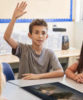 Student raising hand in social studies class with 10 Poster Set Of American War Paintings For Social Studies Classrooms And K-12 Teachers, 12 X 18 Inch History Posters, Learning Materials For US History Made In USA on table.