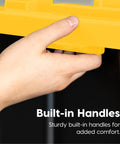 Hand holding yellow lid of Two Pack 27 Gallon Heavy Duty Storage Bins With Lockable Lids For Truck Bed Organization, built-in handle.