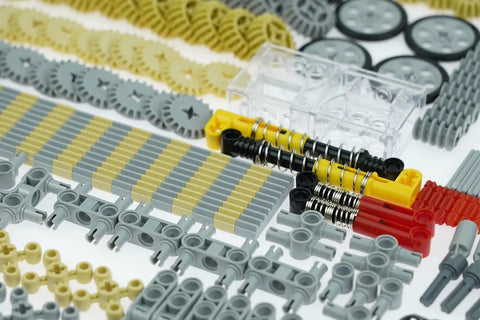 MaleKo Tech Gears And Axles Set 800 Plus Pieces Building Block Accessories Compatible With Major Brands Motors Wheels Chains Connectors Tires And Shock Absorbers visible with gears, wheels, and connectors.