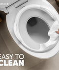 Toddler Potty Training Seat With Sure Grip Handles And Non Slip Base For An Easy Peasy Transition To The Big Toilet Includes Splash Guard Plus Handy Wall Hook Gray being wiped clean.