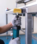 HARFINGTON 2-inch bristle disc installed on a cordless drill for metal deburring; yellow abrasive brush