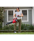 Person using Cordless Leaf Blower With Battery And Charger V20 For Quick Yard Cleanup Up To 110 MPH Air Speed Lightweight Handheld Electric Blower With Brushless Motor 5.0Ah Battery Fast Charge Quiet Operation No Gas in garden