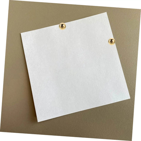 White paper pinned with brass tacks from 200Pcs DIY Craft Nails For Wall Hangings And Scrapbooking Kit With Miniature Tacks Decor Brads