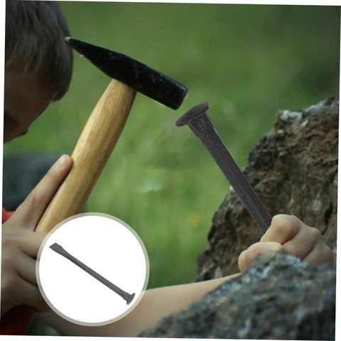 Boy using a hammer on a heavy duty mason chisel and drawknife wielding kickass carbon steel for rock solid brickwork.
