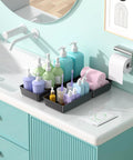 Ten Pack Large Plastic Drawer Organizer Set With Extra Large Large And Medium Trays For Desk Vanity Makeup Bathroom Kitchen Utensils And Office Black Keeps Every Drawer Neat Tidy And Easy To Access arranged on a bathroom counter holding toiletries.