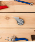 Heavy Duty Sliding Barn Door Hardware Guide Roller With Anti Sag Bottom Support Wheel Screws Included Easy Install No Fuss 3.42X1.85X1.29In For Ultra Smooth Operation shown on wooden surface with tools
