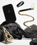 Survival Fire Starter Kit With All In One Ferro Rod Striker Tinder Wick And Bellows Waterproof Camping Gear displayed on black rocks