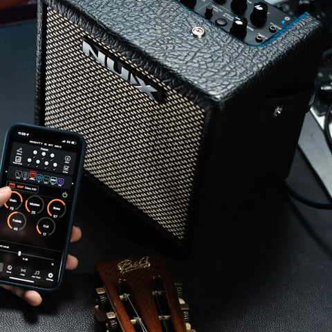 Mighty 8BT MKII 8W Portable Modeling Amp with Bluetooth control, 6.5 inch FRFR speaker, drum machine, and guitar headstock visible