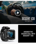 Descent X30 Dive Computer with Surface GPS, 2.4 Inch Display, and Multi-Gas Profiles, shown near a diver preparing gear.