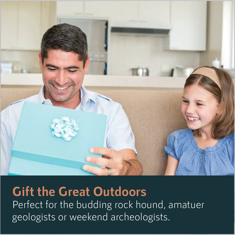 Man smiles while opening a blue gift box with a young girl, text promoting "Gift the Great Outdoors" on geology tools kit with bag.