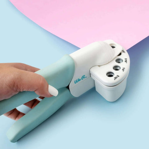 Multi Size Hole Punch For Leather, Paper, Fabric And More Rotates Through Five Hole Sizes shown punching pink paper