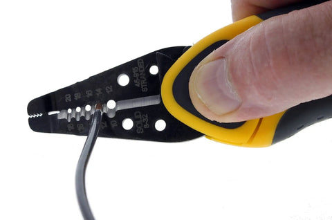 Kinetic Reflex T-Stripper 45-915 Wire Stripper for 10-20 AWG with thumb rest, shown stripping wire insulation with precise cutting action