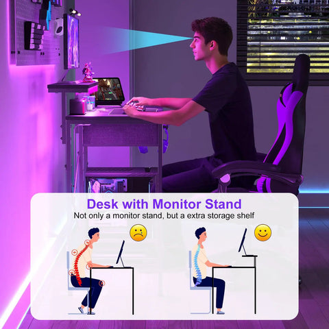 Person using 33.5 Inch Compact Gamer Desk With Remote RGB LED Lights And 3 In One Power Hub Monitor Stand CPU Stand Built In Storage Drawer And Side Hooks Space Saving Gaming Table For Home Office Or Bedroom Black.
