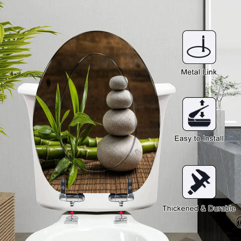 Elongated white zen balance stones bamboo plant wooden table Toilet Seat on a white toilet, showing soft-close feature.