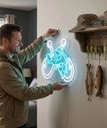 Man hanging Ice Blue Crossed Fish Hook Neon Sign LED Light Dimmable Wall Decor for tackle shops, yachts, man caves.