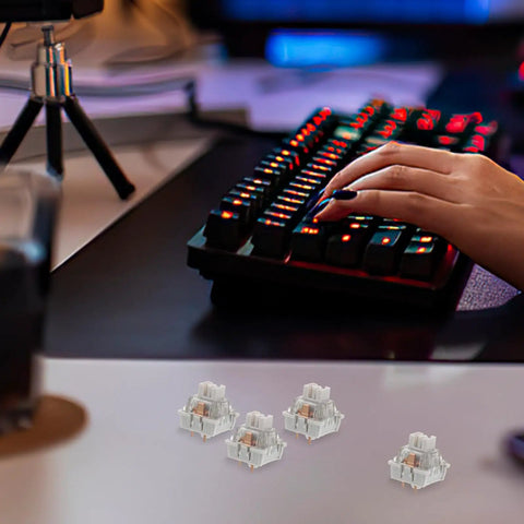 Smooth Ride 10 Pack Linear Switches For Mechanical Keyboards Factory Lubed Abs And Pom Stems on gaming desk with keyboard in use.