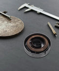 Universal Drill Press Return Spring Kit For Precise Drilling, Steel Quill Spring With Reliable Tension And Shock Absorption, Replacement Coil For Bench Drills And Industrial Drill Presses, DIYers And Pros in open metal housing