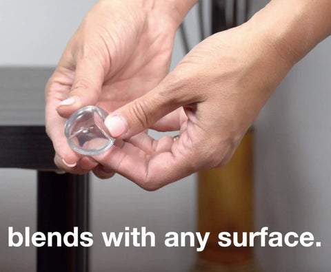 Hand holding 24 Pack Ultra Clear Corner Guards With Pre Applied Adhesive, Table Edge Protectors For Safe Play And Easy Install.