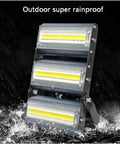 JUDYSSY Led Flood Lights Outdoor, Lens Security Lights Ip67 Waterproof and High, Warm White, 30W showing rainproof design in action.