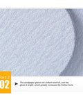 100 Pack Assorted Sanding Disc Set High Grade SiC Grits close-up on smooth surface showing texture for wet and dry polishing.