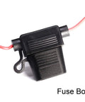 Close-up of a black fuse box with red wiring, part of the Universal Heated Steering Wheel Kit For Cars No Fuss DIY Winter Warm Pad With Blue Lamp Switch 12V Hand Warmer For 15-Inch Steering Wheels Easy Install Durable Flocking Cloth.