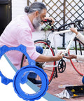 Lockring Tool For Bikes Pro Grade Lightweight Aluminum Rotor Adapter in blue, shown near a bike repair scene