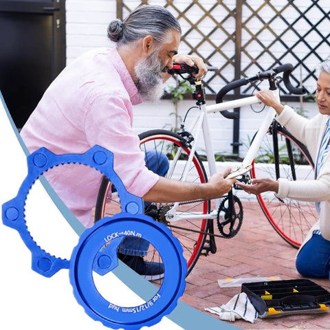 Lockring Tool For Bikes Pro Grade Lightweight Aluminum Rotor Adapter in blue, shown near a bike repair scene