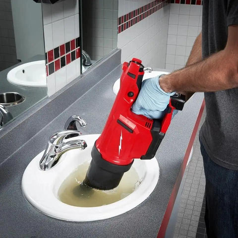 Cordless Drain Cleaning Air Gun Kit With Variable Pressure Control And Quick Swap Auger Tips For Sinks Toilets And Drains Quickly Unblocks Nasty Pipe Clots Fast While Providing Twenty Five Rapid Blast Cycles Per Charge For Pros Only in use over a clogged sink.