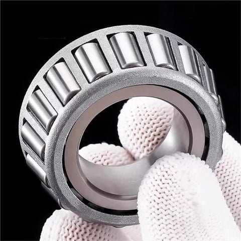 Badass Stainless Steel Tapered Roller Bearings S32014 70mm By 110mm By 25mm showing close-up detail held in gloved hand.