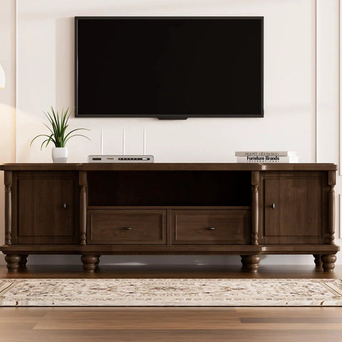 Wooden TV cabinet with closed shelves and drawers under a wall-mounted flat-screen TV in a modern living room.