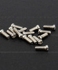 Badass Slick Stainless Steel Micro Screws And Nuts Kit For Eyeglasses Smartwatches Phones Tablets Laptop Repair Assorted Tiny Fasteners scattered on black background.