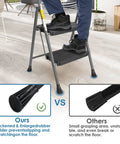 Two Step Folding Ladder With Wide Anti Slip Pedals And Comfort Handle Lightweight Steel Heavy Duty 500 Pound Capacity Portable Multi Use Stool, showing rubber feet on wooden floor.