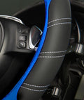 Slick Microfiber Leather Steering Wheel Cover Universal 14.5 To 15 Inch with black and blue stitching, fitted on a steering wheel.