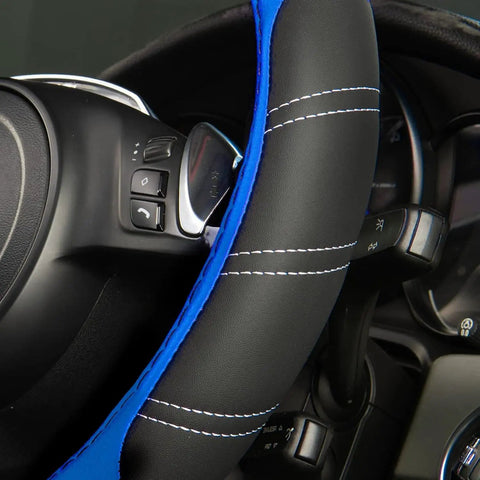 Slick Microfiber Leather Steering Wheel Cover Universal 14.5 To 15 Inch with black and blue stitching, fitted on a steering wheel.