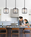 Three Pack Black Pendant Lights For Kitchen Island Industrial Lantern Style Hanging Lamps over a modern kitchen setup