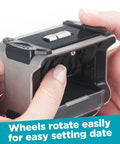 Heavy Duty Self Inking Date Stamp With Snap Cover Crisp Blue Ink Markings Valid Through 2033 For Daily Office Use Fast Rotation Ring showing date wheels being adjusted.